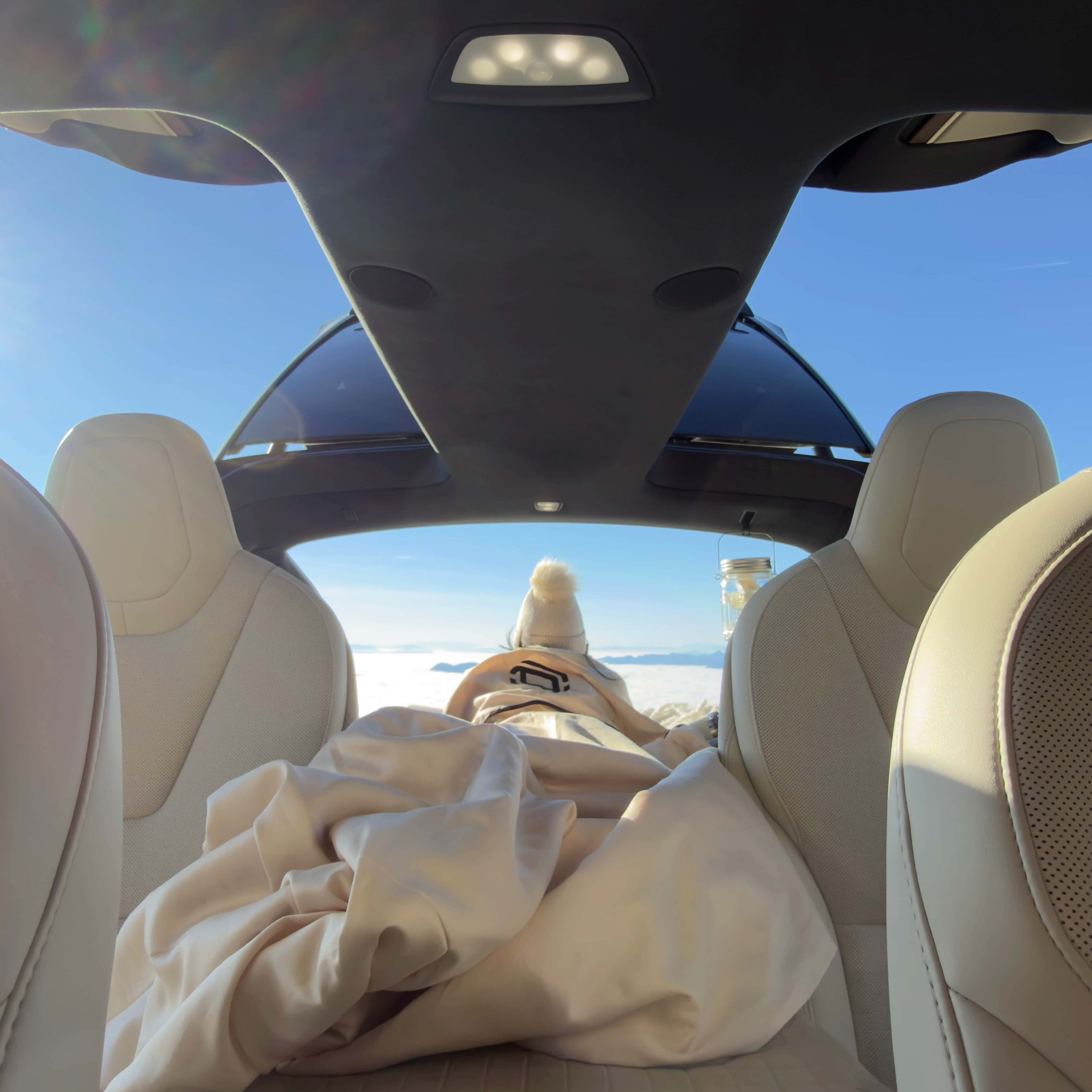 Panoramic view from Dreamcase car bed setup inside Tesla Model X 6-seater cabin