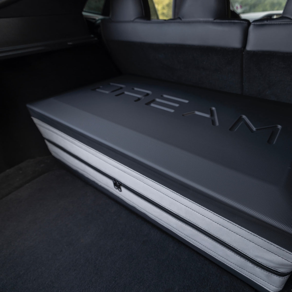 Close-up of the Dreamcase Classic hard shell case with embossed logo stored in the trunk